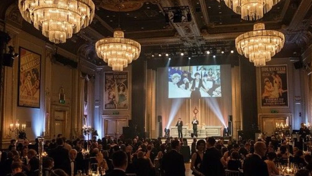 Elegant guests mingling at a high-end rooftop soirée with luxury décor, gourmet catering, and branded experiences—capturing the essence of Exclusive Lifestyle Events.