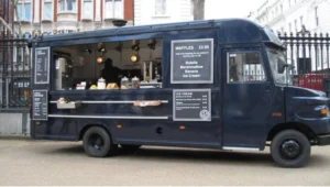 A vibrant food truck serving customers on a busy city street, representing the growing popularity of the food truck business.