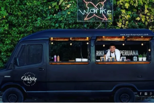 A vibrant food truck serving customers on a busy city street, representing the growing popularity of the food truck business.