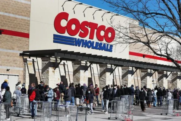 "Exterior view of Business Costco Lynnwood warehouse with shoppers entering and large signage visible"