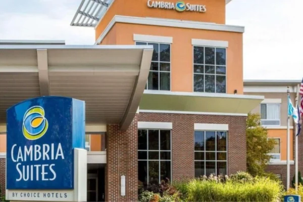 "Exterior view of Cambria Hotel Traverse City with entrance and hotel signage visible"