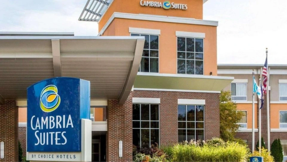 "Exterior view of Cambria Hotel Traverse City with entrance and hotel signage visible"