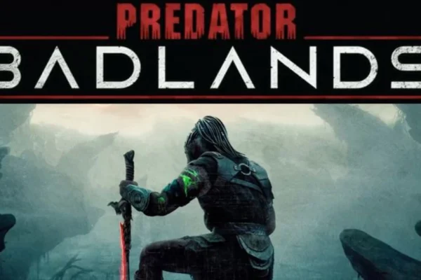 Cover art of Predator: Badlands comic, featuring the Predator standing atop a rocky desert landscape under a stormy sky.