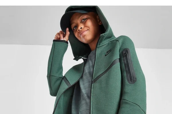 A stylish green Nike Tech fleece set, featuring a zip-up hoodie and joggers.