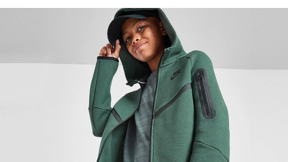A stylish green Nike Tech fleece set, featuring a zip-up hoodie and joggers.