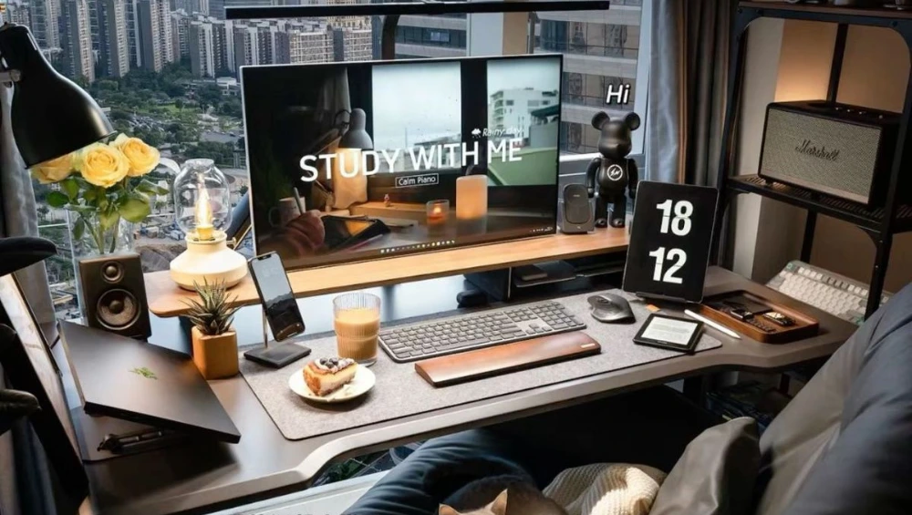 A modern tech table setup with smart devices, laptops, and digital accessories.