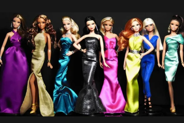 A lineup of Barbie Fashionista dolls showcasing diverse styles, body types, and fashion trends on a brightly lit display shelf.
