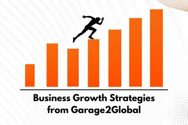 A professional workspace showing a diverse team collaborating over charts and laptops, illustrating business growth strategies from Garage2Global.