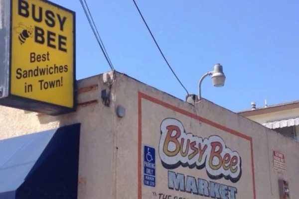 Exterior of Busy Bee San Pedro, a classic American diner with vintage signage and outdoor seating.