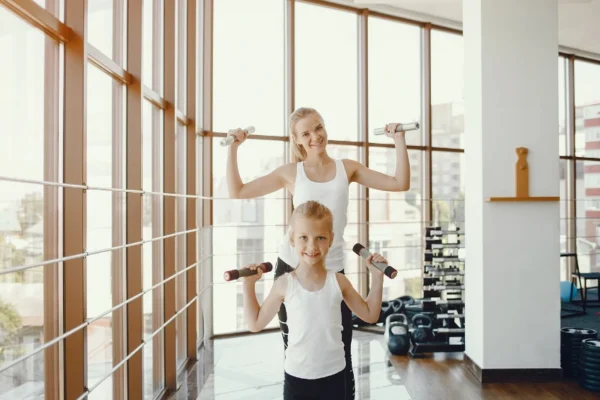 Students and athletes enjoying activities inside Gregory Gym at UT Austin, showcasing the gym’s vibrant fitness and sports environment near UT Tower.