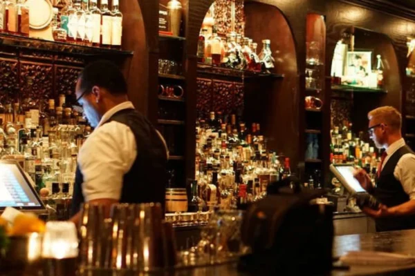 Cozy interior of Herbs and Rye Las Vegas with classic cocktails and elegant vintage decor.