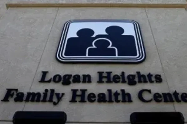 Front façade of the Logan Heights Family Health Center building at 1809 National Ave in San Diego, showing its multi-story exterior under clear skies.