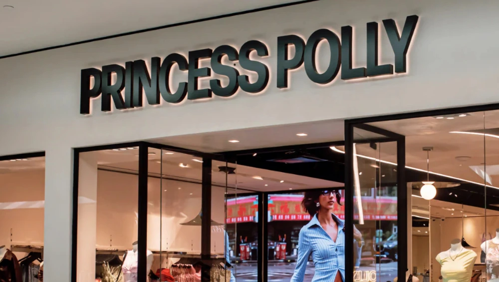 Exterior storefront of Princess Polly Fashion Valley , featuring the bold brand signage above a bright and inviting mall entrance with visible mannequins inside.