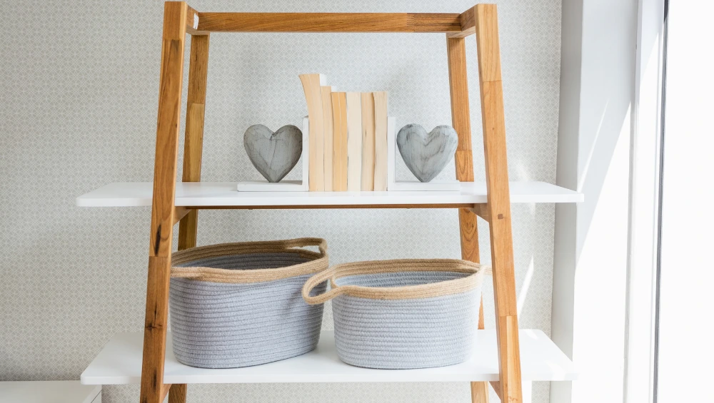 Beautiful rosboxar pink storage boxes arranged in Scandinavian home décor setting with plants and natural light