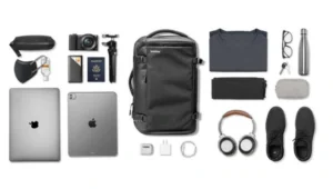 Front and side view of the Tomtoc Travel Backpack 40L, showing its sleek design, durable exterior, and multiple compartments ideal for carry-on travel.

