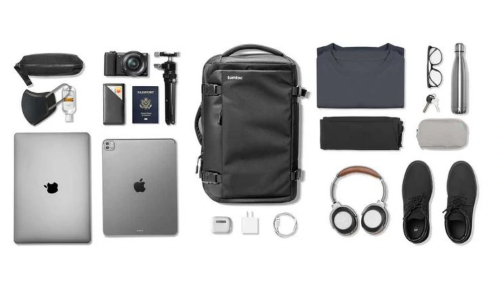 Front and side view of the Tomtoc Travel Backpack 40L, showing its sleek design, durable exterior, and multiple compartments ideal for carry-on travel. 