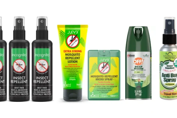 Compact travel size mosquito repellent spray bottle placed on a tropical background, ideal for carry-on bags or outdoor adventures.