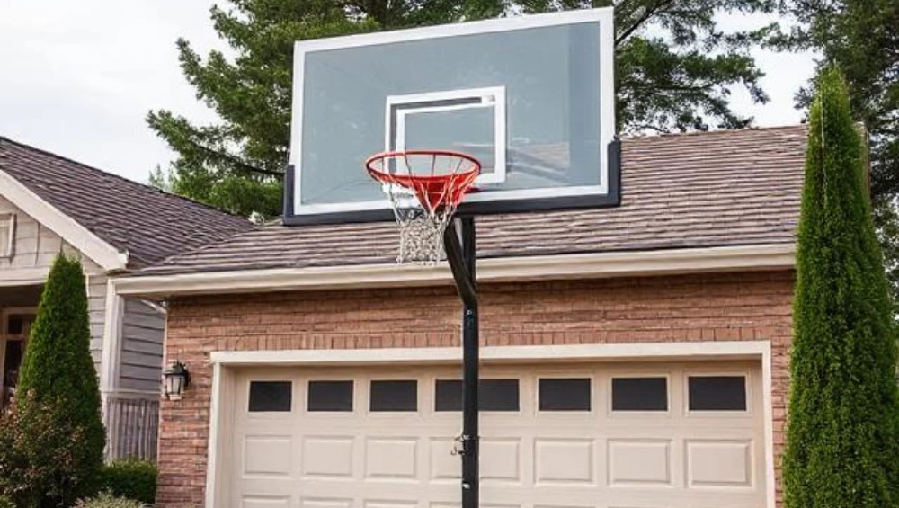 Zuyomernon system basketball hoop installed in driveway with adjustable height mechanism and professional-grade backboard